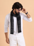 A luxury scarf in navy blue and brown checkered pattern with a geometric design 