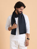 A luxury scarf in navy blue and brown checkered pattern with a geometric design 